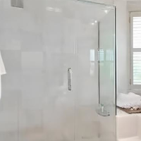 Large frameless shower screen in bathroom